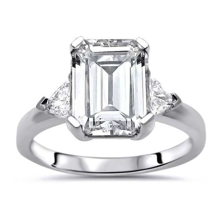 Emerald cut diamond ring hotsell with trillion side stones